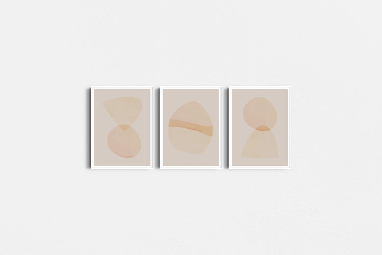 Three abstract art prints with geometric shapes on a white background