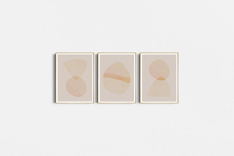 Three abstract art prints with circular shapes on a light gray background