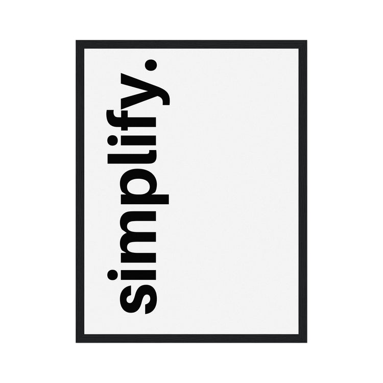 Framed poster with 'simplify.' text on a white background