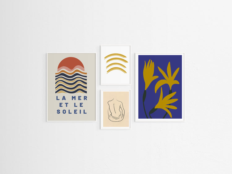 Set of four abstract art prints on a white wall