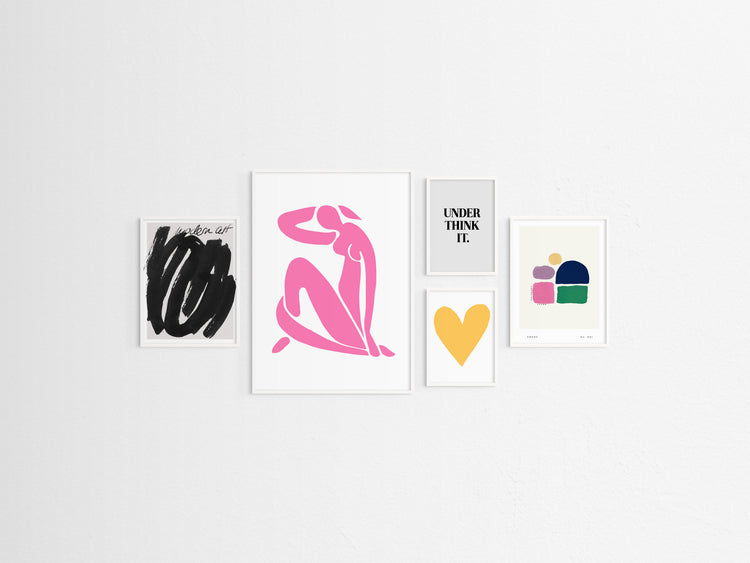 Five framed pop artworks on a white wall