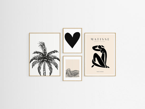 Set of four framed artistic prints on a white wall
