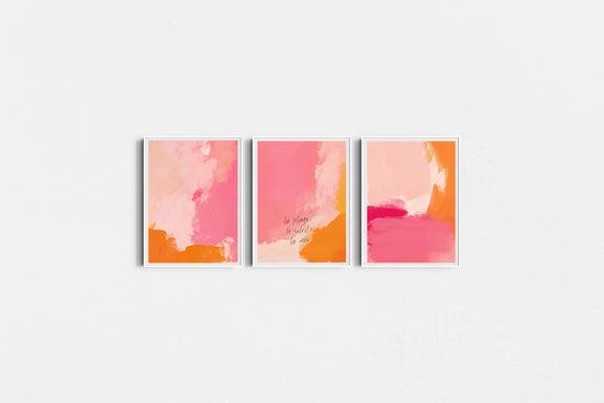 Three abstract art prints with pink and orange hues on a white background