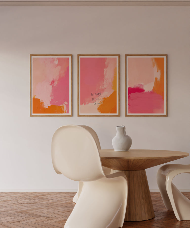 Modern interior with abstract art on the wall and a wooden table with chairs.