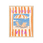 Framed artwork with beach scene, lounge chairs, and umbrella with 'La Dolce Vita' text.