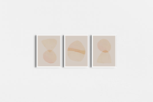 Three abstract art prints with geometric shapes on a white background
