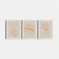 Three abstract art prints with circular shapes on a light gray background