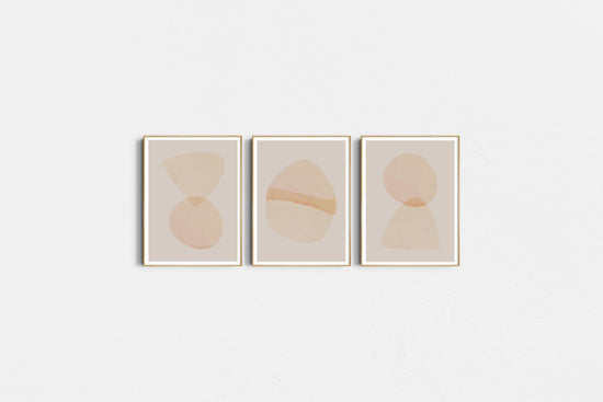Three abstract art prints with circular shapes on a light gray background