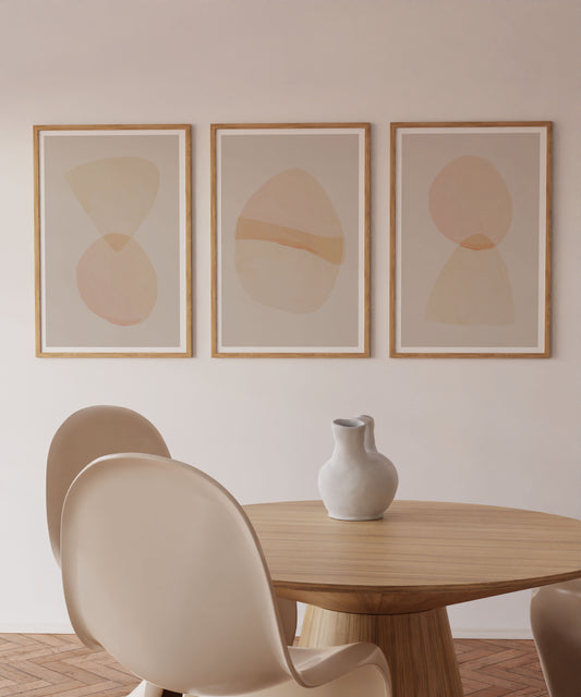 Dining room with a wooden table, white chairs, and abstract art on the wall.