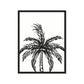 Framed black and white palm tree art print on a white background