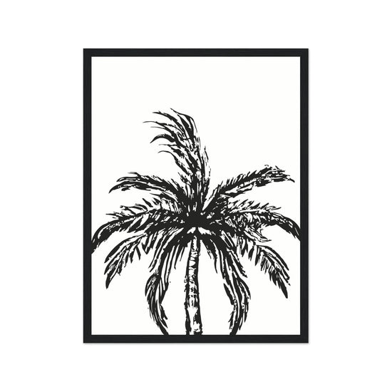 Framed black and white palm tree art print on a white background