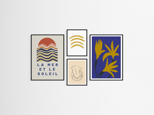 Set of four framed artworks on a white wall