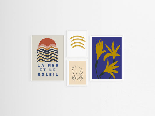 Set of four abstract art prints on a white wall