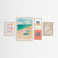Five framed beach themed artworks on a white wall