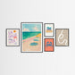Set of framed beach themed artworks on a white wall