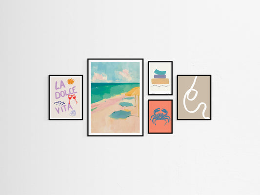 Set of framed beach themed artworks on a white wall
