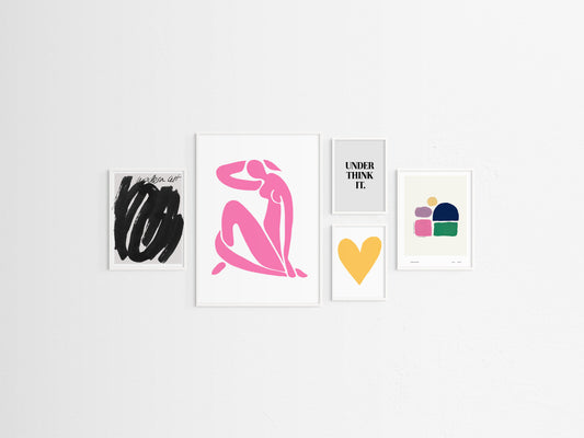 Five framed pop artworks on a white wall
