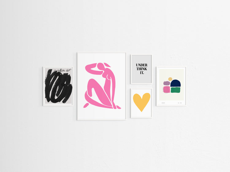 Five framed pop artworks on a white wall